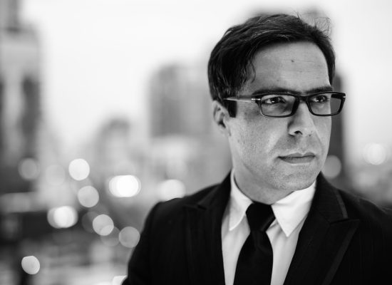 handsome persian businessman against view of the city